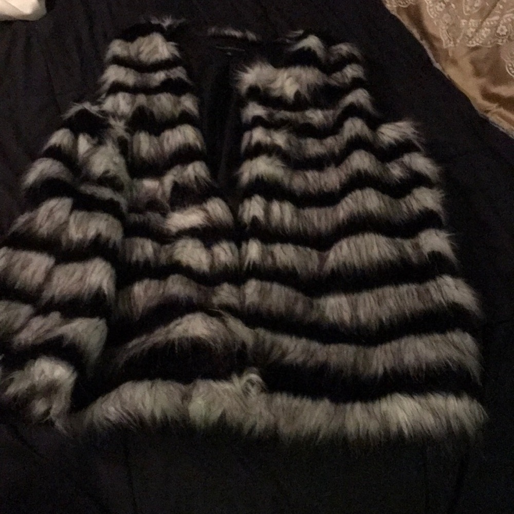 Black gray and white vest
